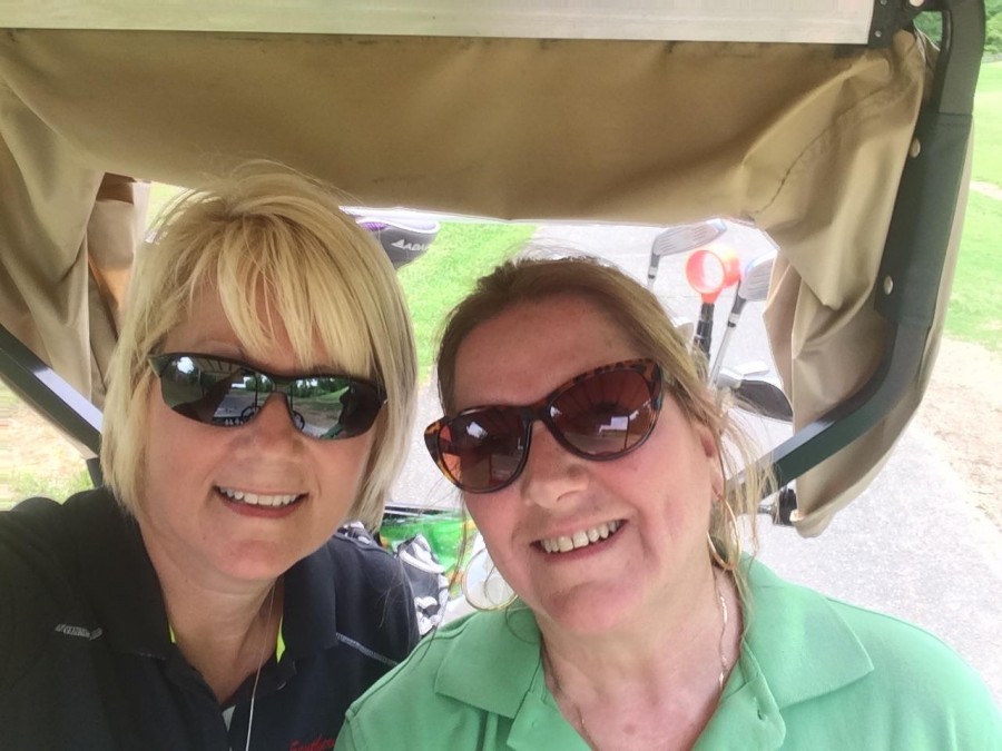 Lynne Skilton of Southern Corrosion golfing with Sheila Moore of West Carteret County.